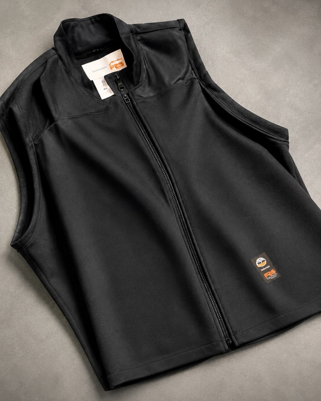 Dark vest product on a clean background